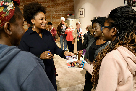 Tracy K. Smith chats with and signs copies of “American Journal” for audience members at the Jean Lafitte Wetlands Acadian Cultural Center in in Thibodaux, LA. December 14, 2018. Credit: Ryan Rabalais.