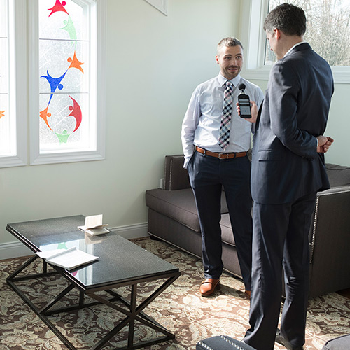 Tracy K. Smith and Rob Casper, head of the Library of Congress Poetry and Literature Center, speak to Phillip Justice, program director and campus manager of the Men's Addiction Recovery Campus, in Bowling Green, Kentucky. March 16, 2018. Credit: Shawn Miller.