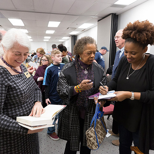 Tracy K. Smith signs books for event audience members at the South Central Kentucky Cultural Center in Glasgow, Kentucky. March 16, 2018. Credit: Shawn Miller.