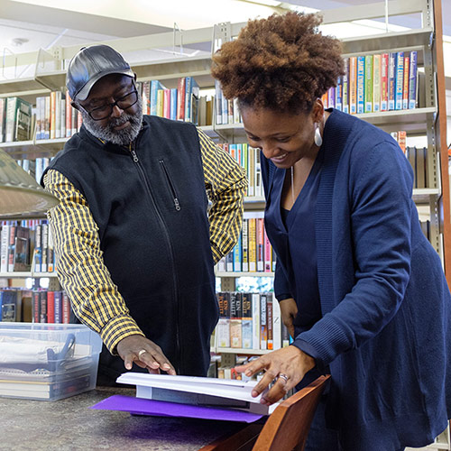 Tracy K. Smith speaks with community member Jimmy Curle before a reading and discussion at the New Haven Branch of the Nelson County Public Library in New Haven, Kentucky. March 17, 2018. Credit: Shawn Miller.