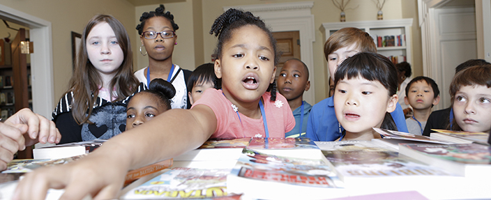 Children explore and learn about a unique collection of Advanced Reader Copies (ARCs) in the Young Readers Center. Publishers submit free copies of books to the Center before they are printed and distributed to book stores and libraries, and any visitor is welcome to enjoy a sneak peek at upcoming titles.